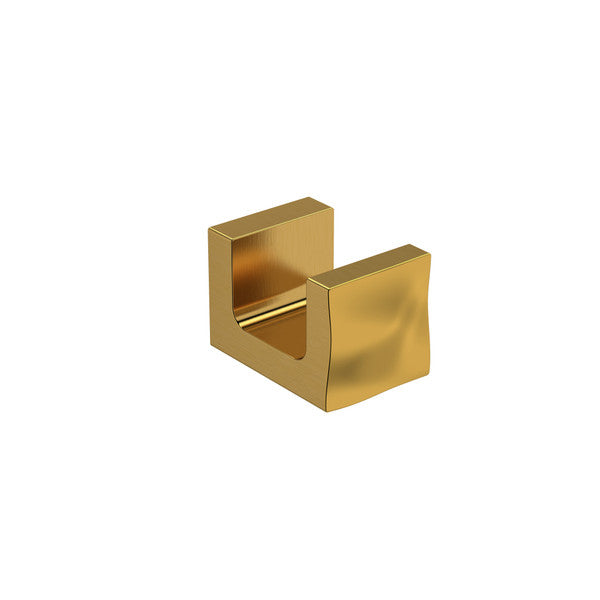 A golden decorative hook with a modern design.