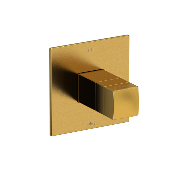 A modern, golden faucet handle mounted on a square plate.